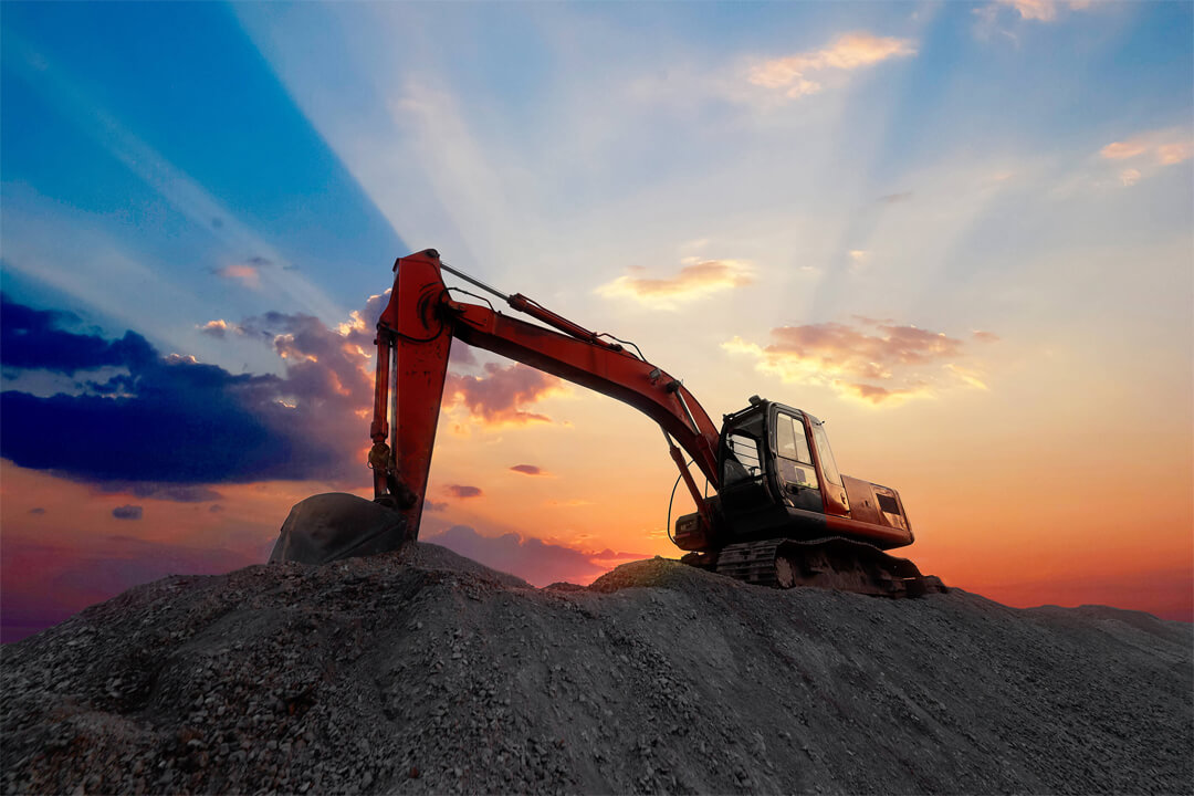 Excavator Digging Dirt Mound