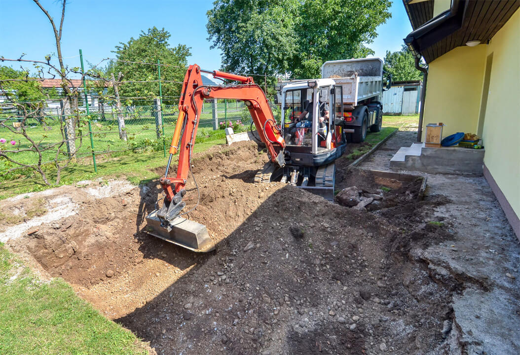 Excavator Removing Yard For New Patio