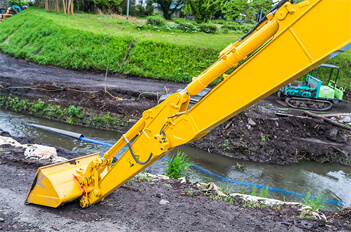 Excavator Digging Drainage Trench